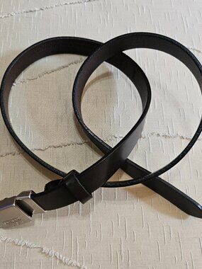 COACH BELT FEATURED IN RICH BROWN POLISHED COWHIDE WITH SILVER TONE CLIP CLOSURE